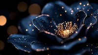 Magical glowing dark blue flower with illuminated golden center and bokeh lights creating mystical atmosphere against black background. Macro nature photography.