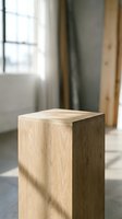 Wooden pedestal with natural oak texture in a sunlit minimalist interior, product display stand with soft bokeh background.