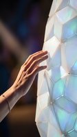 Hand touching illuminated hexagonal tiles with iridescent glow, representing interactive technology, digital innovation, and futuristic interface design for apps and websites.