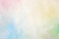 Soft pastel watercolor background with gentle blending of pink, yellow, blue and green hues creates dreamy ethereal effect for artistic designs and layouts.