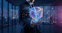 Businessman holding glowing holographic cube with digital network connections in modern office at night. Futuristic technology concept for innovation and data visualization.