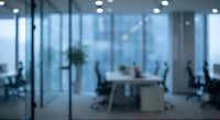 Blurred modern office interior with glass partitions, conference room, and contemporary furniture creating professional workspace atmosphere.