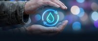 Male hands holding glowing water droplet hologram symbol against blurred bokeh background. Concept for environmental conservation, sustainability, clean energy, water resources management.