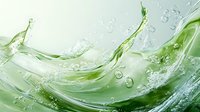 Fresh green water splash with dynamic liquid motion and transparent bubbles against light background, abstract fluid art for refreshing beverage advertising.