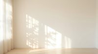 Empty room interior with natural sunlight streaming through window creating geometric shadow patterns on beige wall and wooden floor for home design.