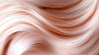 Flowing waves of rose gold and peach colored hair strands create abstract wavy pattern with soft highlights and shadows. Luxury beauty salon background.