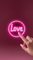 Glowing pink neon love sign with female hand reaching to touch illuminated circle on burgundy background, modern romantic concept for social media and design.