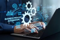 Business process automation concept with glowing gears and digital icons floating above laptop keyboard for workflow optimization and efficiency solutions.