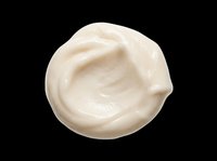 Creamy white cosmetic product swirl isolated on transparent background, ready for skincare, beauty, and wellness design projects including packaging, posters, and digital marketing materials.