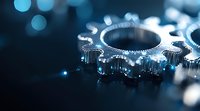 Metallic gears with blue lighting effect on dark background, shallow depth of field creates dramatic industrial machinery close-up for business and technology concepts.