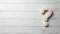 Wooden question mark symbol on white rustic planks background with copy space for text and design elements.