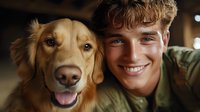 Young man with light brown curly hair and fair complexion smiling with golden retriever dog indoors, pet companionship and bonding moment for lifestyle and family content.