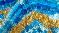 Abstract blue and gold marble texture with flowing organic patterns and metallic accents for luxury design backgrounds and artistic projects.