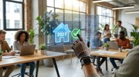 Smart home technology concept with hand holding tablet displaying house icon and 2027 year projection in modern office workspace with diverse team collaborating in background.