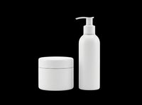 White cosmetic bottles with pump dispenser and jar isolated on transparent background, ready for skincare, beauty, and personal care product design, packaging mockups, and print-on-demand applications.