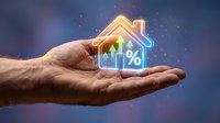 Hands protecting glowing house with percentage symbol and upward arrow, representing mortgage rates, real estate investment and property value growth concept.