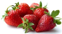 Fresh ripe strawberries with green leaves isolated on white background, showcasing vibrant red color and natural texture for food packaging, recipe blogs, and healthy eating concepts.