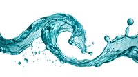 Dynamic turquoise water splash with flowing waves and droplets isolated on white background for refreshing beverage and hydration design concepts.