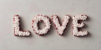 Word LOVE spelled with tiny white and red hearts on light gray background, romantic minimalist composition for valentines day cards and wedding designs.