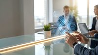 Business professionals using holographic technology interface in modern office meeting room for digital transformation and innovation.