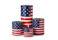 Patriotic candles with stars and stripes pattern in red, white, and blue, isolated on white background. Perfect for holiday decorations, Fourth of July celebrations, and Memorial Day events.