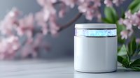 White cosmetic jar with holographic strip on lid against blurred pink cherry blossom background, mockup for skincare and beauty products on gray surface.