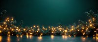 Festive winter border with glowing golden string lights and evergreen branches on dark teal background, creating magical holiday atmosphere.