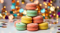 Colorful French macarons stacked in pyramid formation with festive bokeh lights background. Sweet dessert display for celebrations and holidays.