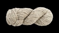 Twisted skein of natural beige wool yarn isolated on transparent background, ready for crafting, knitting, textile, t-shirt design, stickers, and print on demand use.