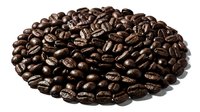 Roasted coffee beans arranged in oval pile on white background, isolated and ready for beverage, cafe, and food industry design projects.