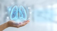 Human hand holding glowing blue lungs hologram with medical icons representing respiratory health, pulmonary care and healthcare technology concepts.