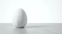White decorative Easter egg with geometric cross pattern on minimalist background for holiday design and seasonal decoration projects.