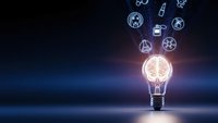 Glowing light bulb with brain inside surrounded by floating renewable energy icons on dark blue background representing innovation and sustainable technology solutions.