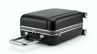 Black hardshell suitcase with retractable handle and wheels isolated on white background for travel and luggage design concepts.