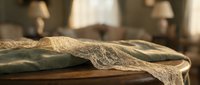 Sheer linen fabric draped over wooden surface with soft natural light, suitable for home decor, textile, and interior design projects.