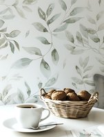 Cup of coffee and wicker basket with walnuts on white table against light floral wallpaper background, creating serene minimalist breakfast composition.