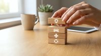 Caucasian woman's hands stacking wooden blocks with insurance icons: home, car, medical, health. Insurance planning and protection concept.