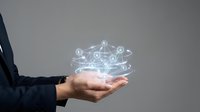 Business professional holding glowing network connections in palm showcasing digital transformation and connectivity solutions for modern enterprises.