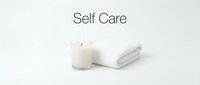 Soft white towel and glowing candle with Self Care text on clean background, evoking relaxation, wellness, and mindful living.