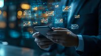 Digital mail icons floating over smartphone in businessperson hands with blue technology background showing modern communication concept.