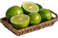 Fresh green limes in rustic woven basket, whole and halved citrus fruits showing juicy pulp on white background, isolated for food and beverage designs.