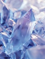 Abstract blue crystal formations with prismatic light reflections creating ethereal geometric patterns for luxury design and meditation backgrounds.