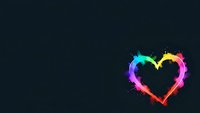 Colorful rainbow heart with paint splashes on dark background for love and romance designs.
