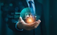 Businessman holding glowing AI chip with digital circuit patterns and data analytics graphics floating above palm in futuristic technology concept.