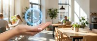 Hand holding glowing digital clock hologram in modern office workspace with natural light and plants, representing time management and technology.