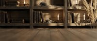 Rustic wooden shelving unit with books and decorative items in warm cozy interior setting with natural lighting and pampas grass accent creating homey atmosphere.