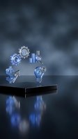Business innovation concept with metallic icons on reflective surface including gears, lightbulb, dollar sign and magnifying glass for corporate presentations.