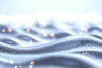 Soft waves of silvery blue abstract background with golden bokeh lights and glittering particles creating dreamy atmospheric effect for luxury designs.