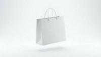 White paper shopping bag with handles isolated on light background for retail branding and commercial design projects.