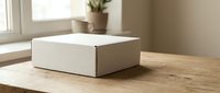 White cardboard shipping box on wooden table near window with natural light for e-commerce packaging and delivery services.